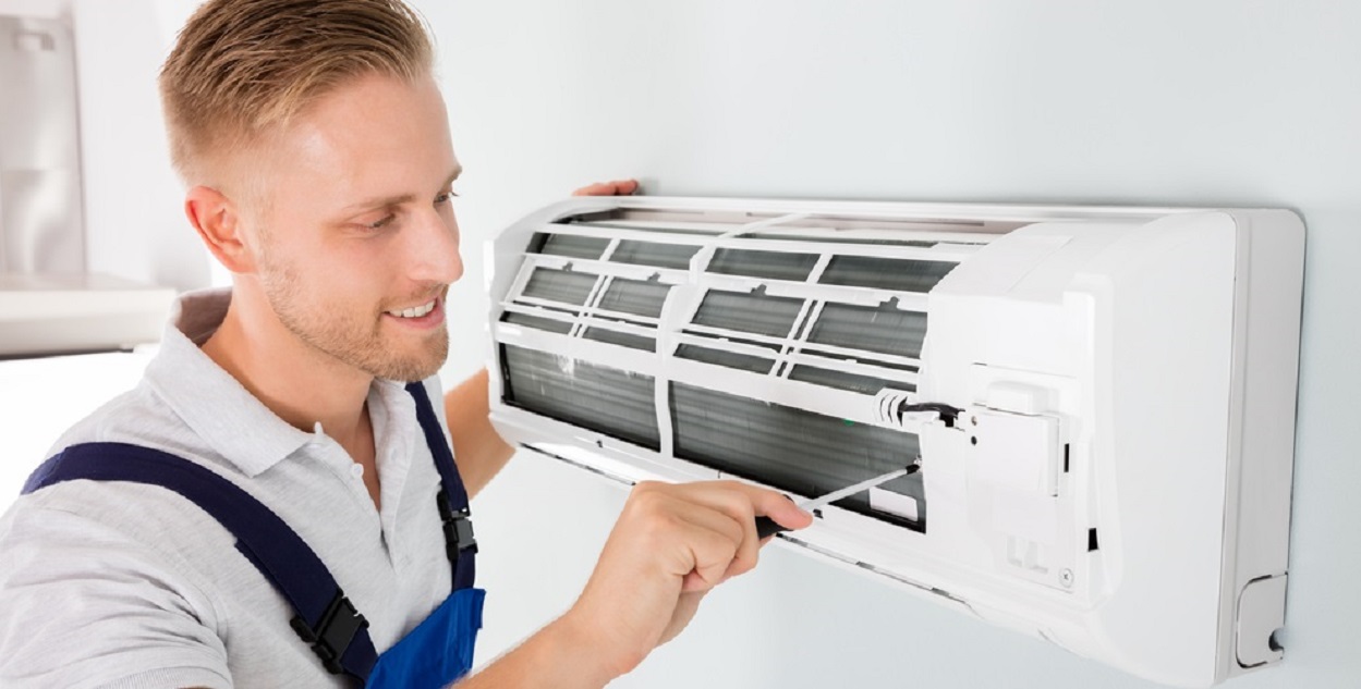 An engineer carrying out an air con maintenance in Harwich, Essex